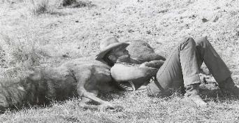 CHUCK RESTING ON THE SET OF WILL PENNY