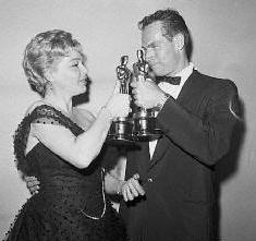Chuck & Simone Signoret(Best Actress) Holding their 'Oscars'