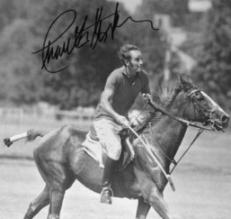 CHUCK PLAYING POLO-AUTOGRAPHED
