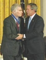 PRES.BUSH SHAKES CHUCK'S HAND AFTER HE HAS GIVEN CHUCK THE PRESIDENTIAL MEDAL OF FREEDOM-2003